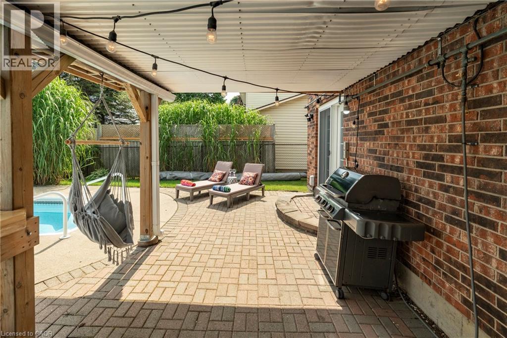 Fenced backyard with area for grilling and a patio - 29 Armstrong Crescent, Grey Highlands, ON - With Deck Patio Veranda With Exterior