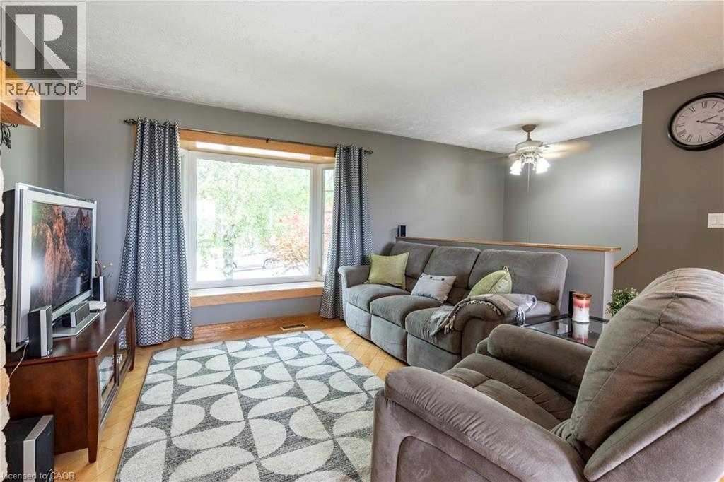 Living area with light wood-style flooring and a ceiling fan - 29 Armstrong Crescent, Grey Highlands, ON - Indoor Photo Showing Living Room