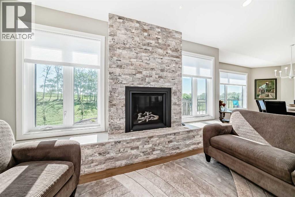 3 - 255049 Township Rd 432, Rural Ponoka County, AB - Indoor Photo Showing Living Room With Fireplace