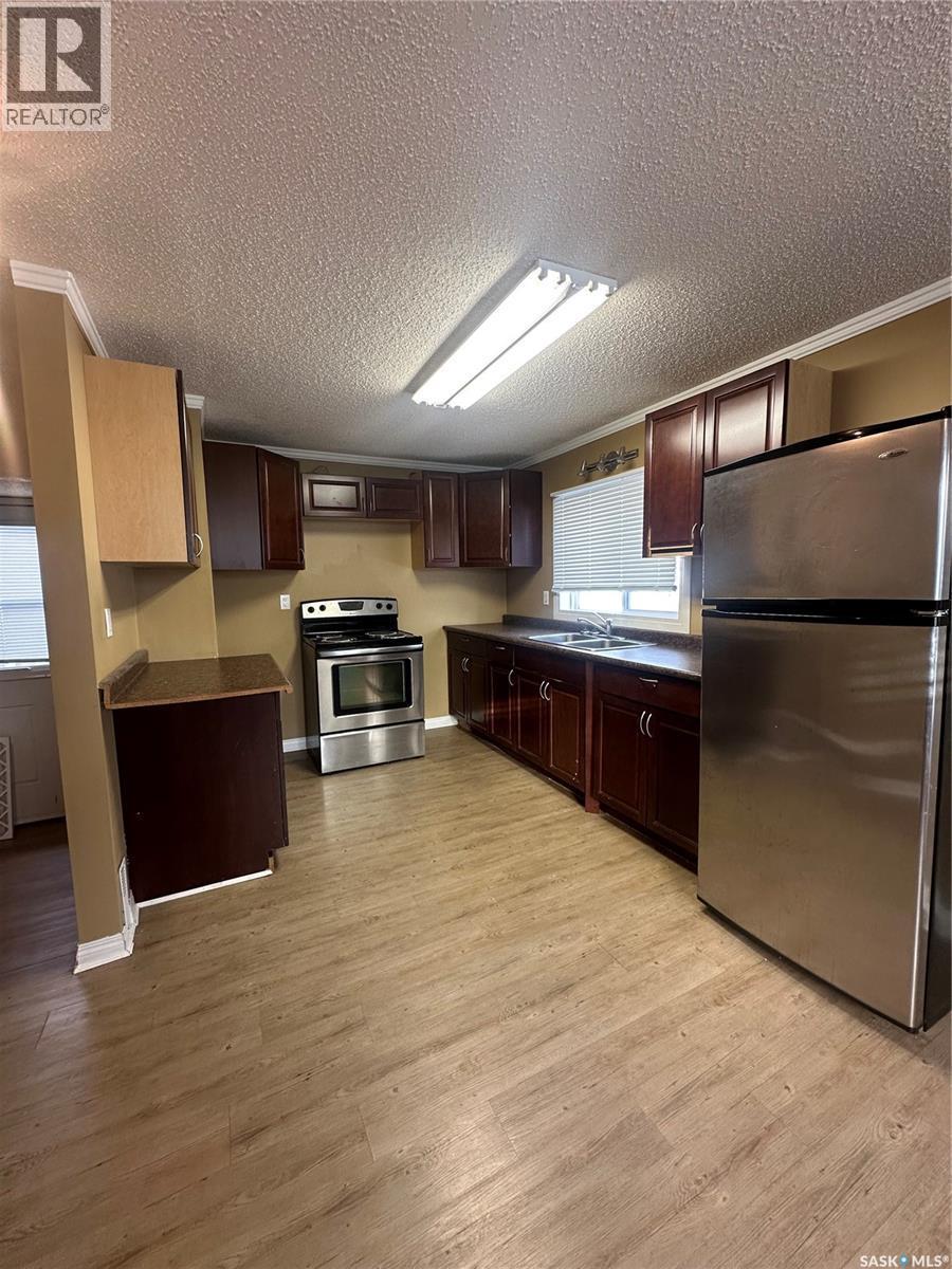 59 Haultain Avenue, Yorkton, SK - Indoor Photo Showing Kitchen With Double Sink