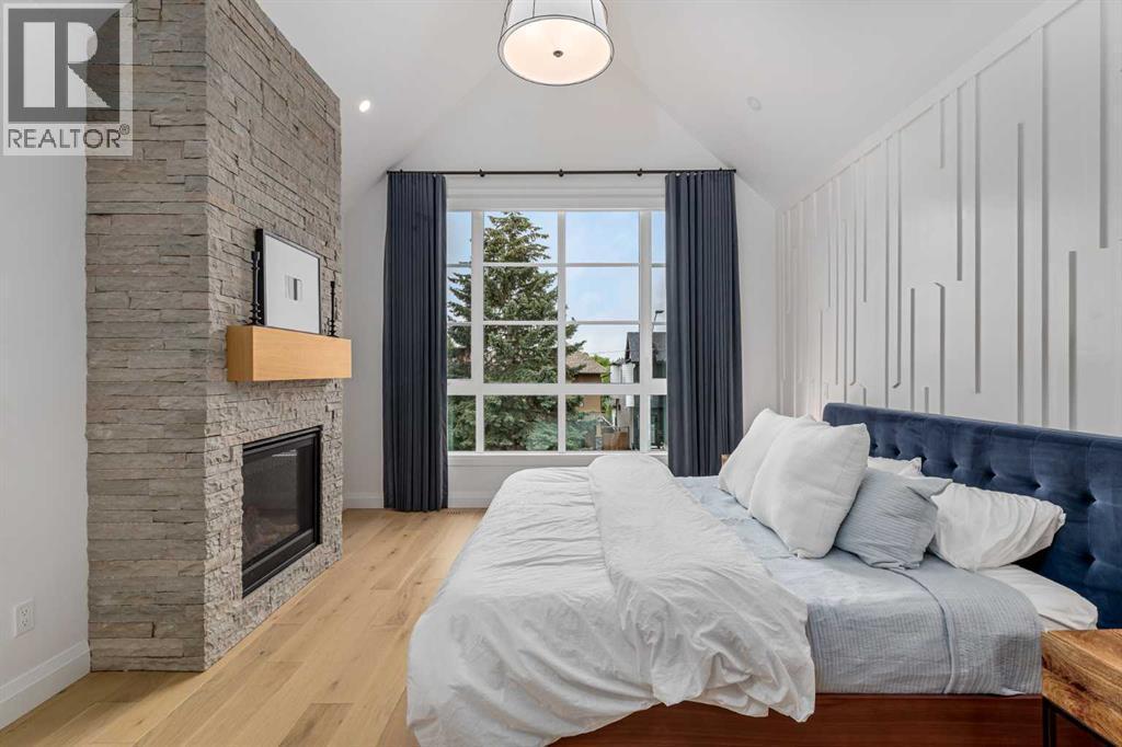 2032 41 Avenue Sw, Calgary, AB - Indoor Photo Showing Bedroom With Fireplace