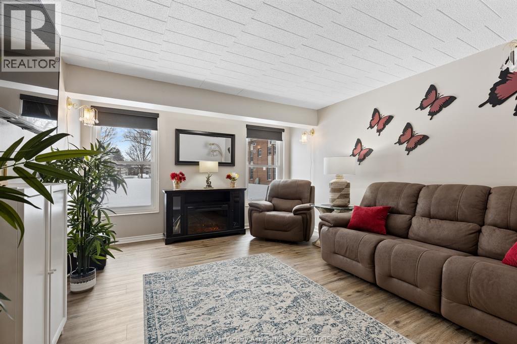 6523 Thornberry Unit# 331, Windsor, ON - Indoor Photo Showing Living Room With Fireplace