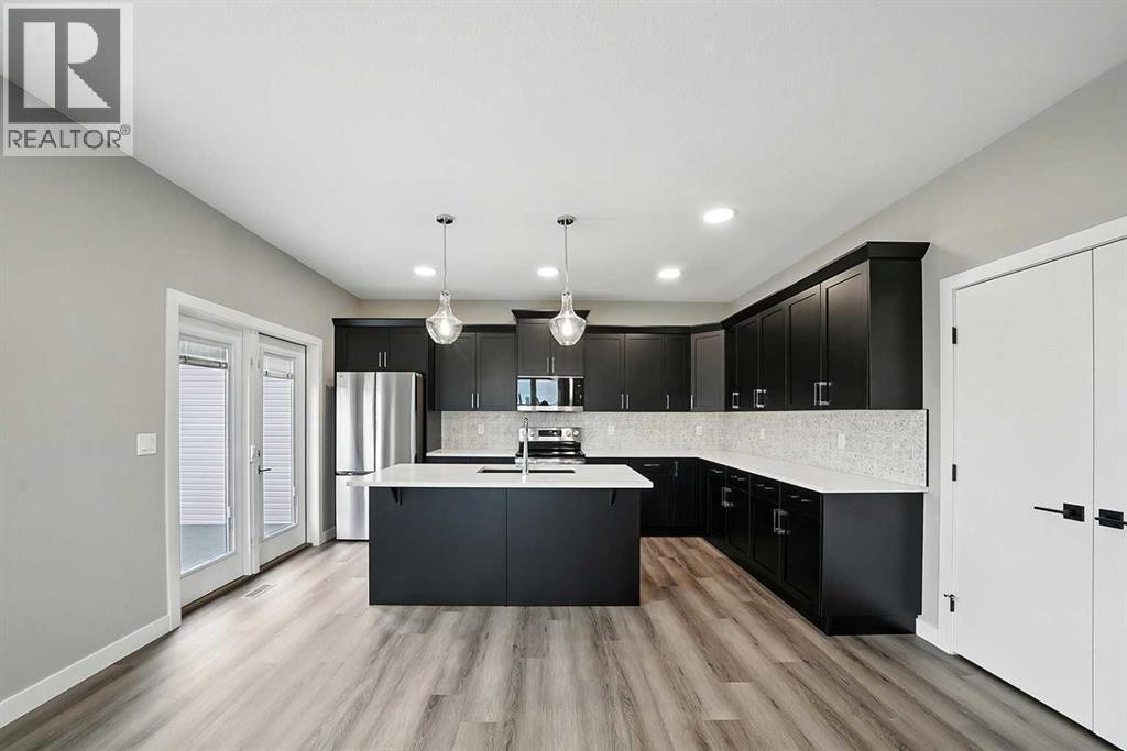 25 Murphy Close, Blackfalds, AB - Indoor Photo Showing Kitchen With Upgraded Kitchen