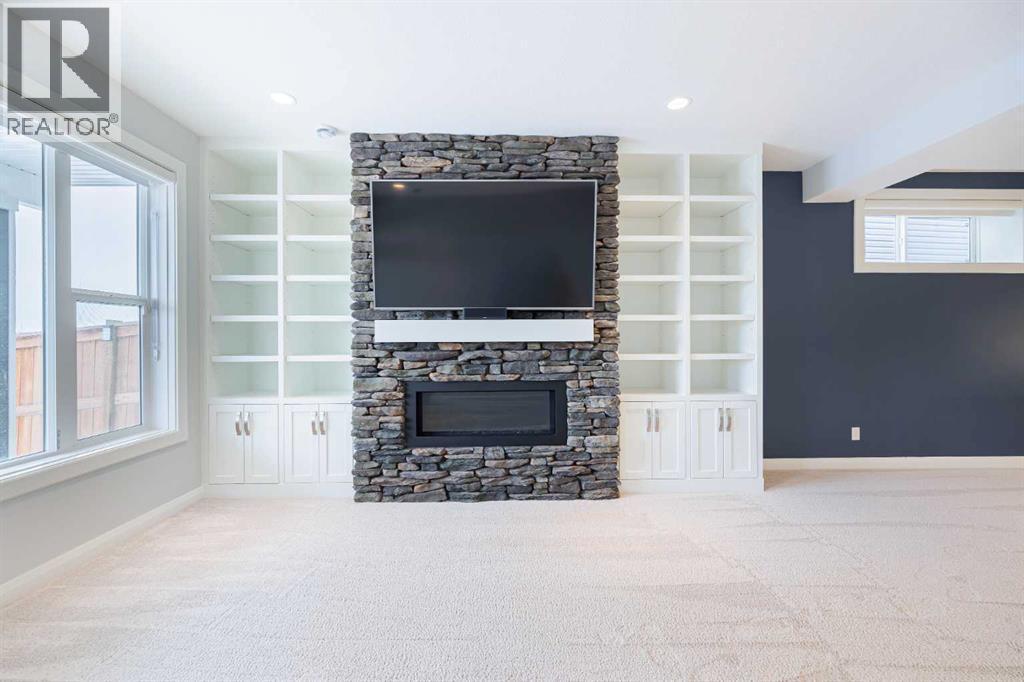 155 Crestridge Hill Sw, Calgary, AB - Indoor Photo Showing Other Room With Fireplace