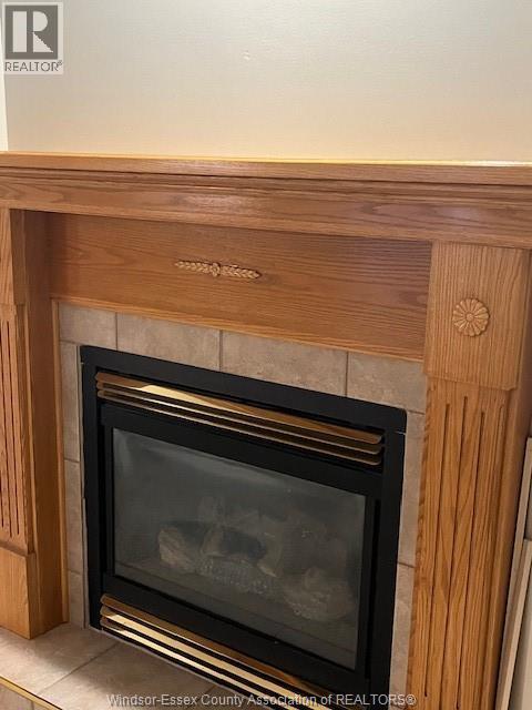 40 Santos, Kingsville, ON - Indoor Photo Showing Living Room With Fireplace