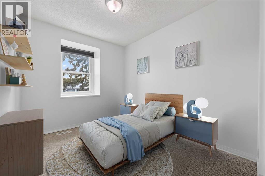 Virtually Staged - 115, 4810 40 Avenue Sw, Calgary, AB - Indoor Photo Showing Bedroom