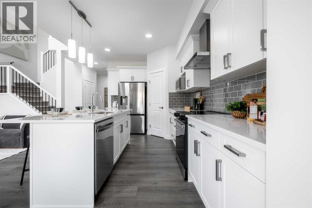 21 Sora Gardens Se, Calgary, AB - Indoor Photo Showing Kitchen With Upgraded Kitchen