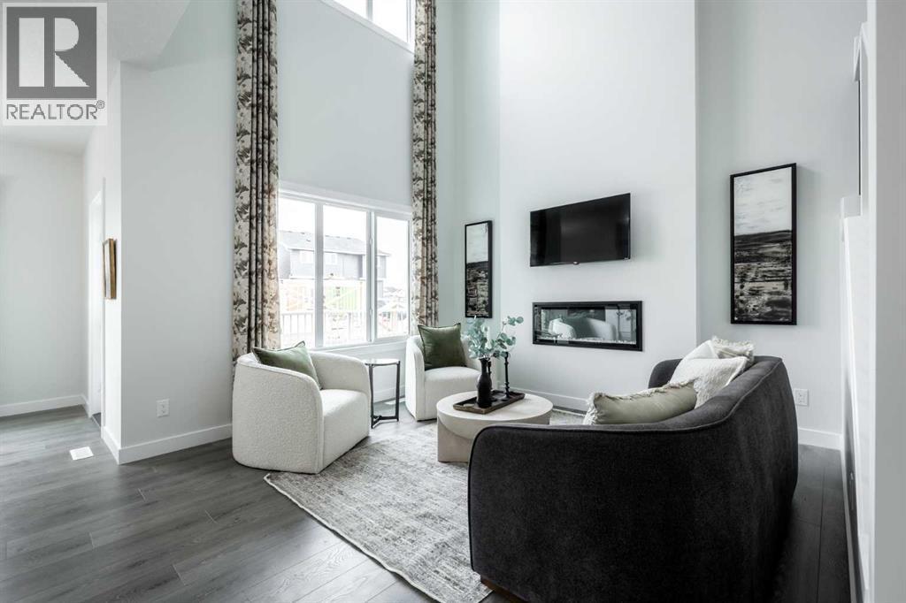 21 Sora Gardens Se, Calgary, AB - Indoor Photo Showing Living Room With Fireplace