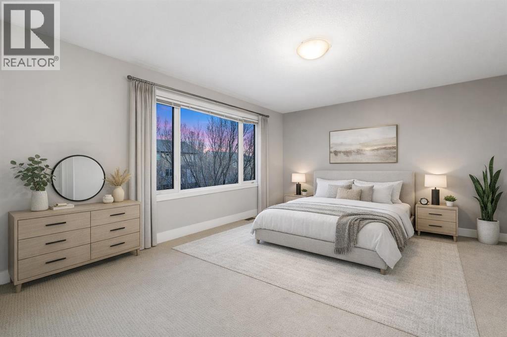 The primary bedroom offers ample space and a 5-piece ensuite (Virtually Staged). - 70 Royal Ridge Manor Nw, Calgary, AB - Indoor Photo Showing Bedroom