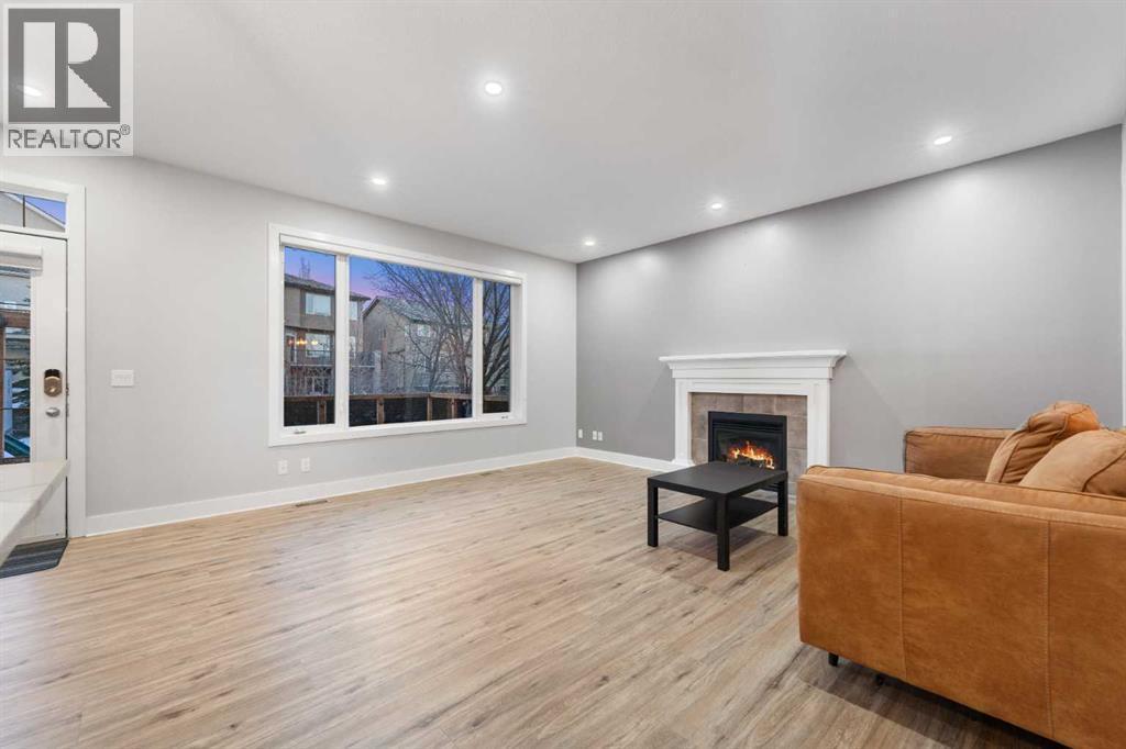 Another view of the main floor living room. - 70 Royal Ridge Manor Nw, Calgary, AB - Indoor With Fireplace