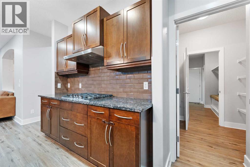 Walk-through pantry providing convenient access to the garage. - 70 Royal Ridge Manor Nw, Calgary, AB - Indoor Photo Showing Other Room
