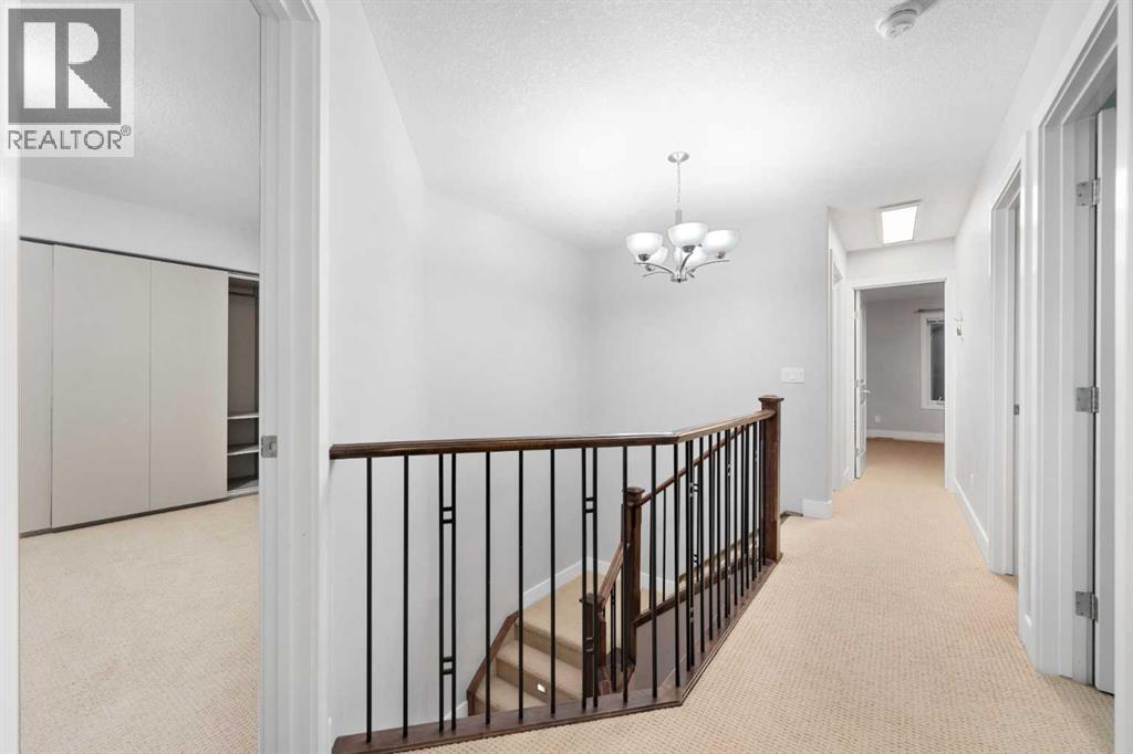 Upstairs features four bedrooms along with a spacious bonus room. - 70 Royal Ridge Manor Nw, Calgary, AB - Indoor Photo Showing Other Room