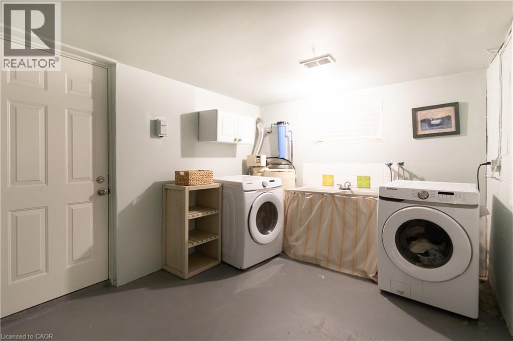 Basement laundry and garage access - 3 Fallsview Road, Hamilton, ON - Indoor Photo Showing Laundry Room