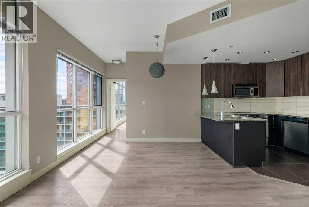 Dining Room and Gourmet Kitchen - 701, 788 12 Avenue Sw, Calgary, AB - Indoor Photo Showing Kitchen With Stainless Steel Kitchen