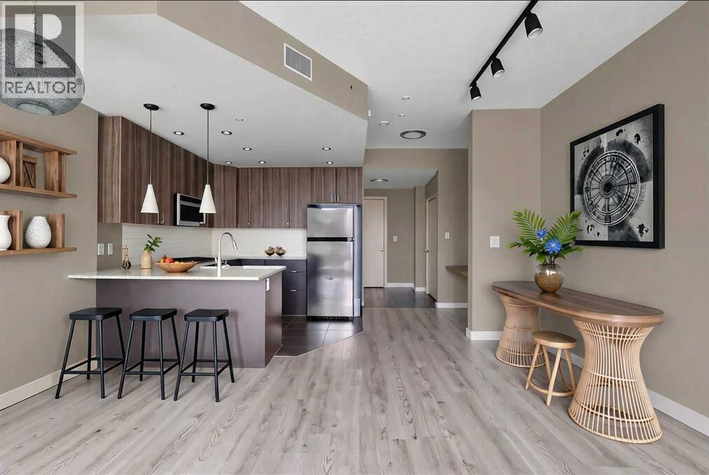 Gourmet Kitchen and Entrance - Virtually Staged - 701, 788 12 Avenue Sw, Calgary, AB - Indoor Photo Showing Kitchen