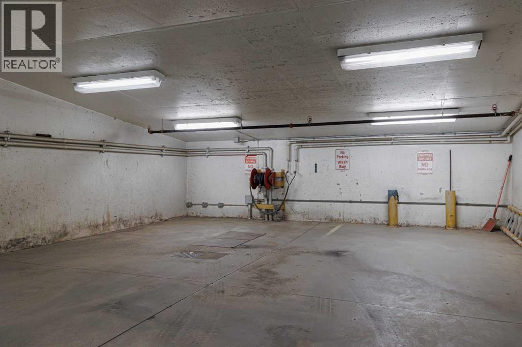 Car Wash Bay - 701, 788 12 Avenue Sw, Calgary, AB - Indoor Photo Showing Garage