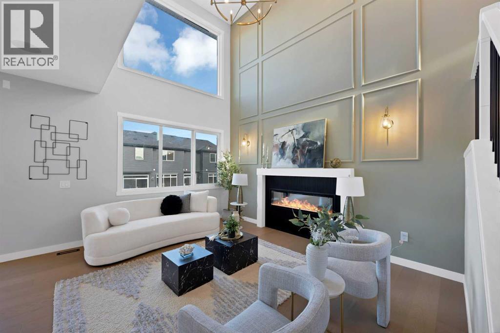 351 Waterford Grove, Chestermere, AB - Indoor Photo Showing Living Room With Fireplace