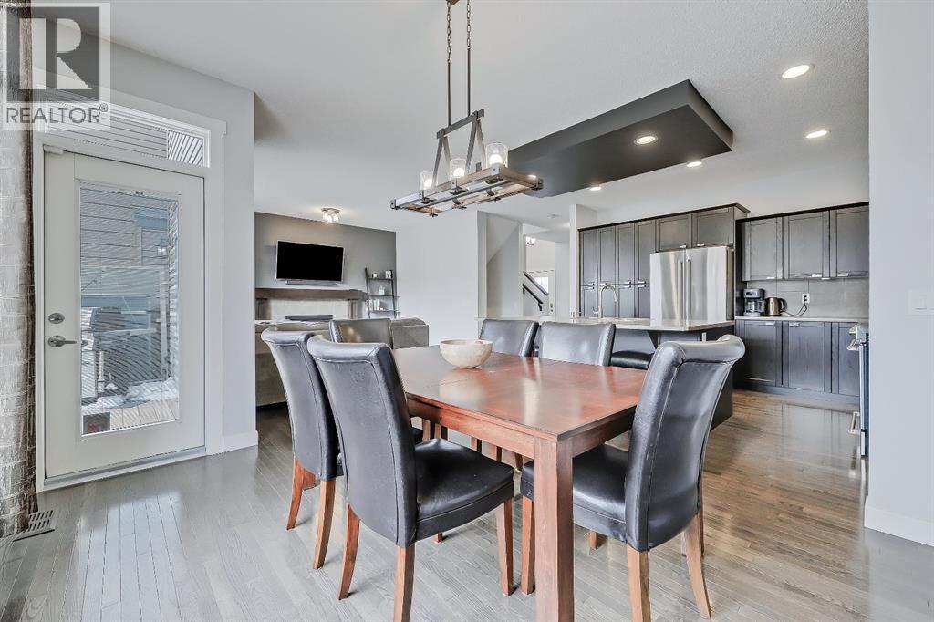 Easy BBQ access to the deck - 9 Copperleaf Way Se, Calgary, AB - Indoor Photo Showing Dining Room