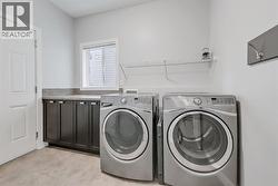 Laundry room with cabinetry -