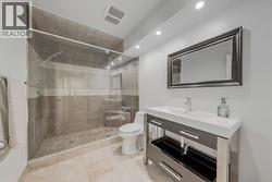 Spa-like basement full bath with tile surround shower -
