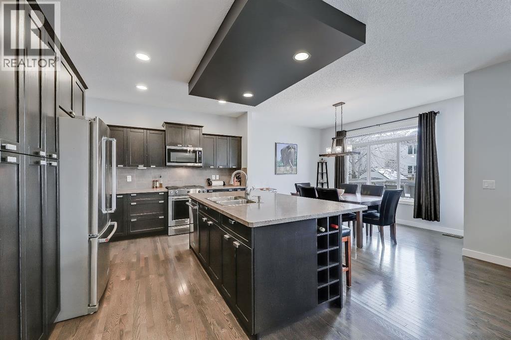 So much great cabinetry - 9 Copperleaf Way Se, Calgary, AB - Indoor Photo Showing Kitchen With Stainless Steel Kitchen With Upgraded Kitchen