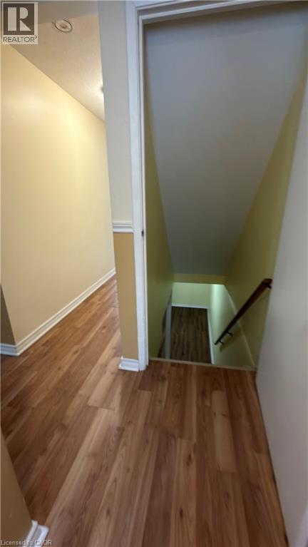 Stairs with wood finished floors and baseboards - 66 Glamis Road Unit# 33, Cambridge, ON - Indoor Photo Showing Other Room