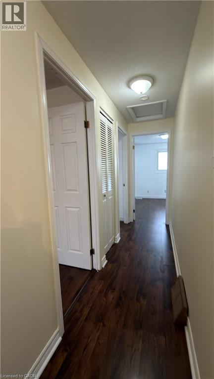 Hallway featuring dark wood-style floors and attic access - 66 Glamis Road Unit# 33, Cambridge, ON - Indoor Photo Showing Other Room
