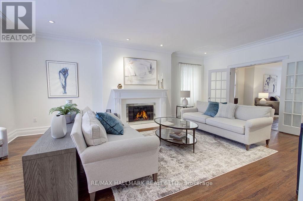 19 Whitney Avenue, Toronto, ON - Indoor Photo Showing Living Room With Fireplace