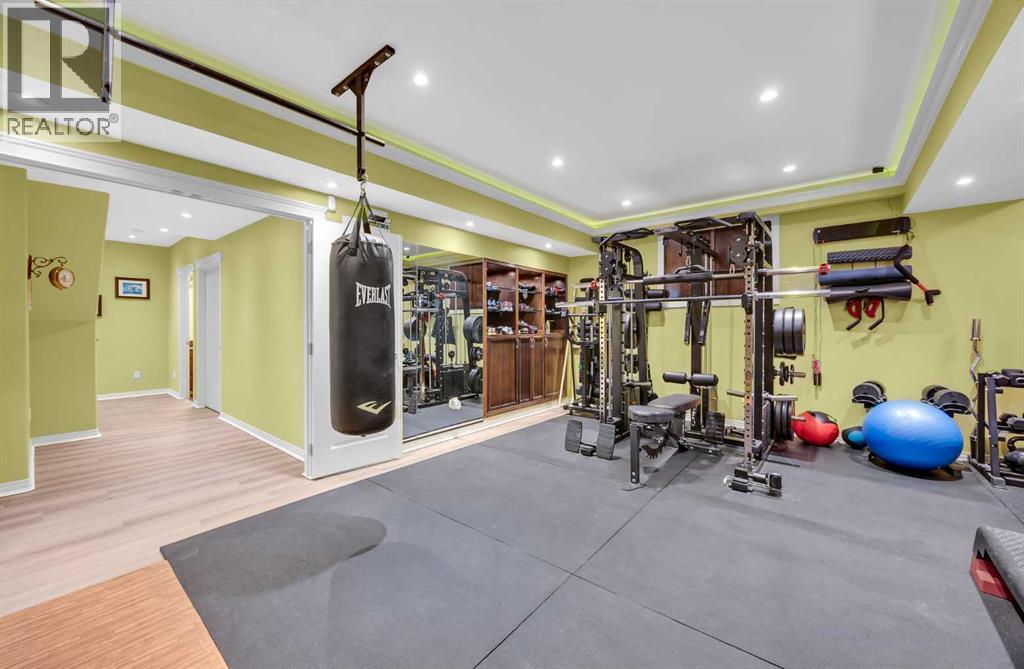 100 Cougarstone Manor Sw, Calgary, AB - Indoor Photo Showing Gym Room
