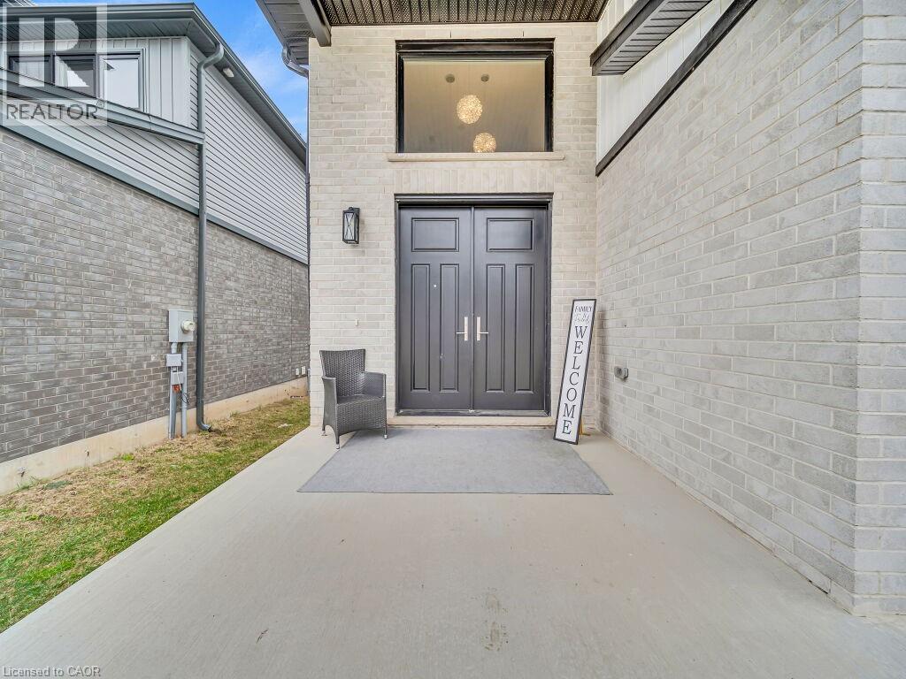 Property entrance featuring brick siding - 3374 Oriole Drive, London, ON - Outdoor With Exterior