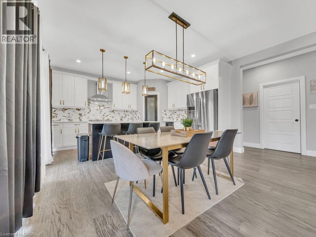 Dining room featuring light wood-type flooring and recessed lighting - 3374 Oriole Drive, London, ON - Indoor Photo Showing Dining Room