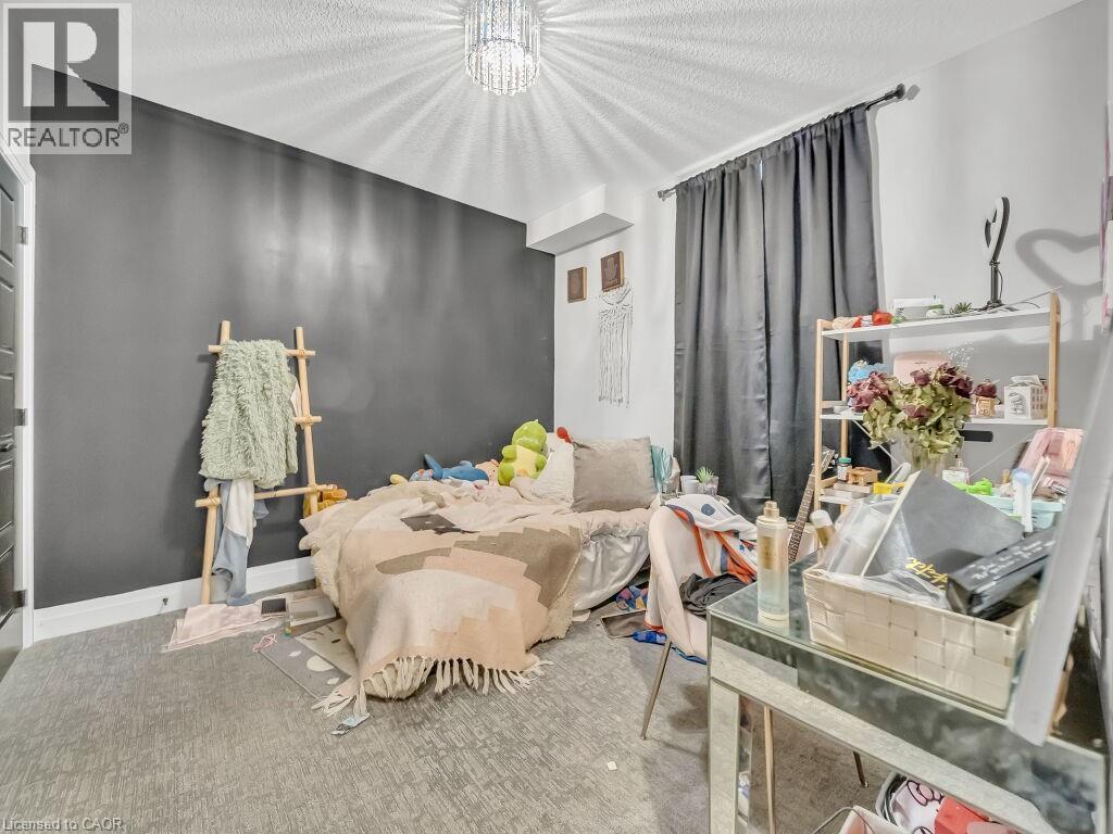 Bedroom with a chandelier - 3374 Oriole Drive, London, ON - Indoor Photo Showing Bedroom