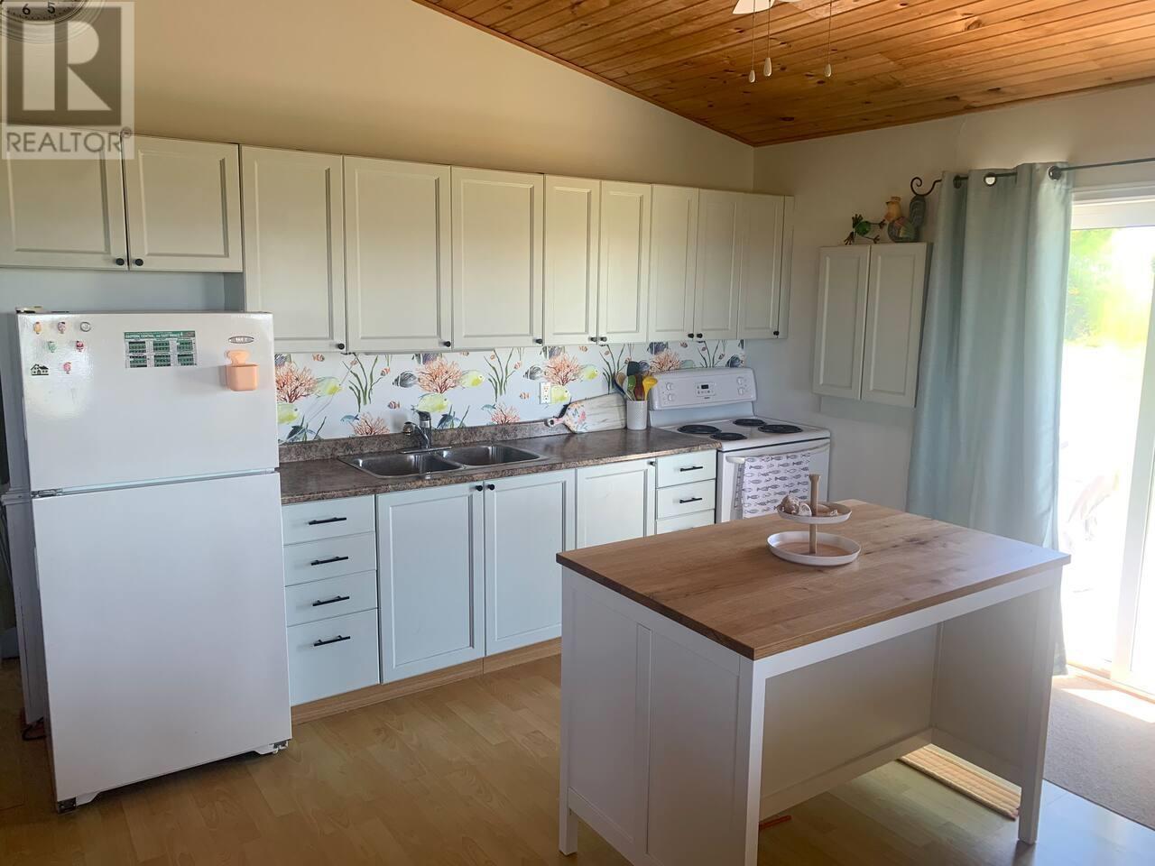 48 Wild Flower Lane, Darnley, PE - Indoor Photo Showing Kitchen With Double Sink