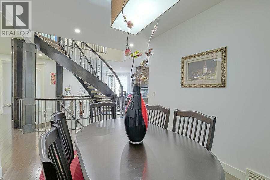 16 Rockcliff Point Nw, Calgary, AB - Indoor Photo Showing Dining Room