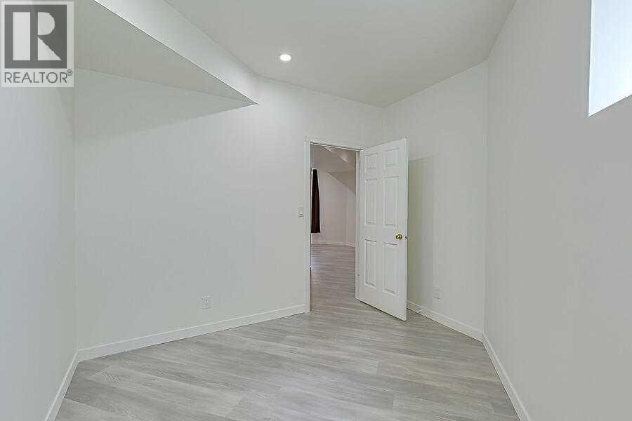 16 Rockcliff Point Nw, Calgary, AB - Indoor Photo Showing Other Room