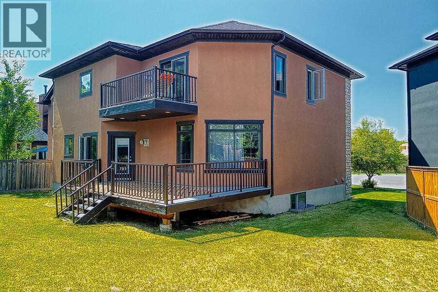 16 Rockcliff Point Nw, Calgary, AB - Outdoor With Deck Patio Veranda