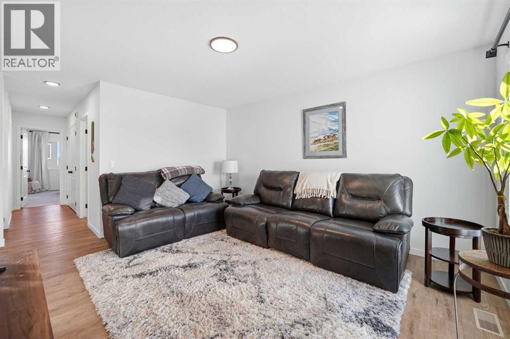 102 Setonstone Manor Se, Calgary, AB - Indoor Photo Showing Living Room