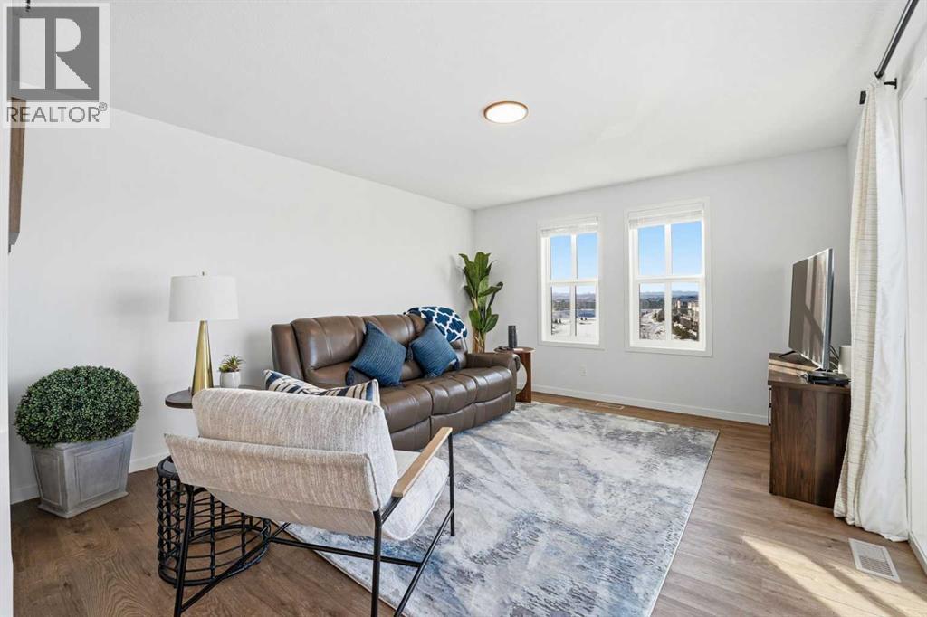 102 Setonstone Manor Se, Calgary, AB - Indoor Photo Showing Living Room
