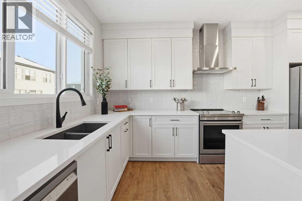 102 Setonstone Manor Se, Calgary, AB - Indoor Photo Showing Kitchen With Double Sink With Upgraded Kitchen