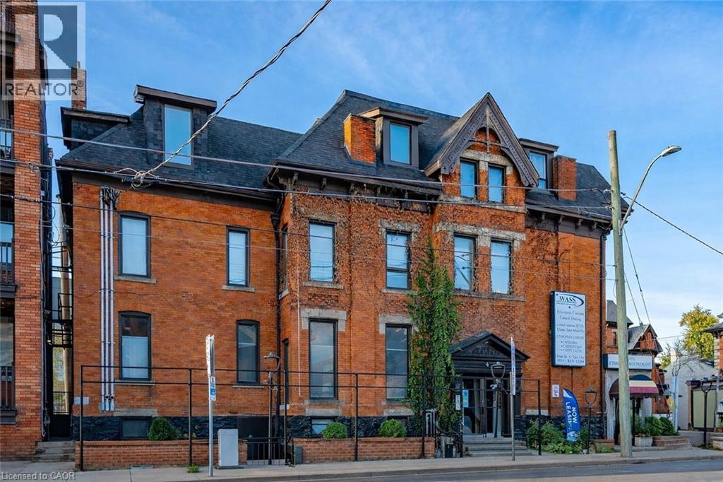 View of front of property featuring brick siding and a shingled roof - 14 Forest Avenue, Hamilton, ON - Outdoor With Facade