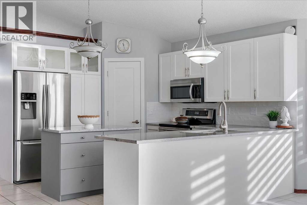 78 Mckenzie Lake Place Se, Calgary, AB - Indoor Photo Showing Kitchen With Double Sink With Upgraded Kitchen