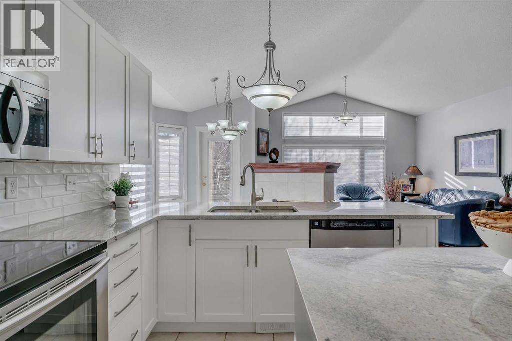 78 Mckenzie Lake Place Se, Calgary, AB - Indoor Photo Showing Kitchen With Double Sink With Upgraded Kitchen