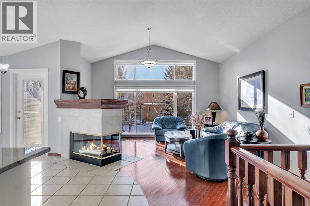 78 Mckenzie Lake Place Se, Calgary, AB - Indoor Photo Showing Other Room With Fireplace