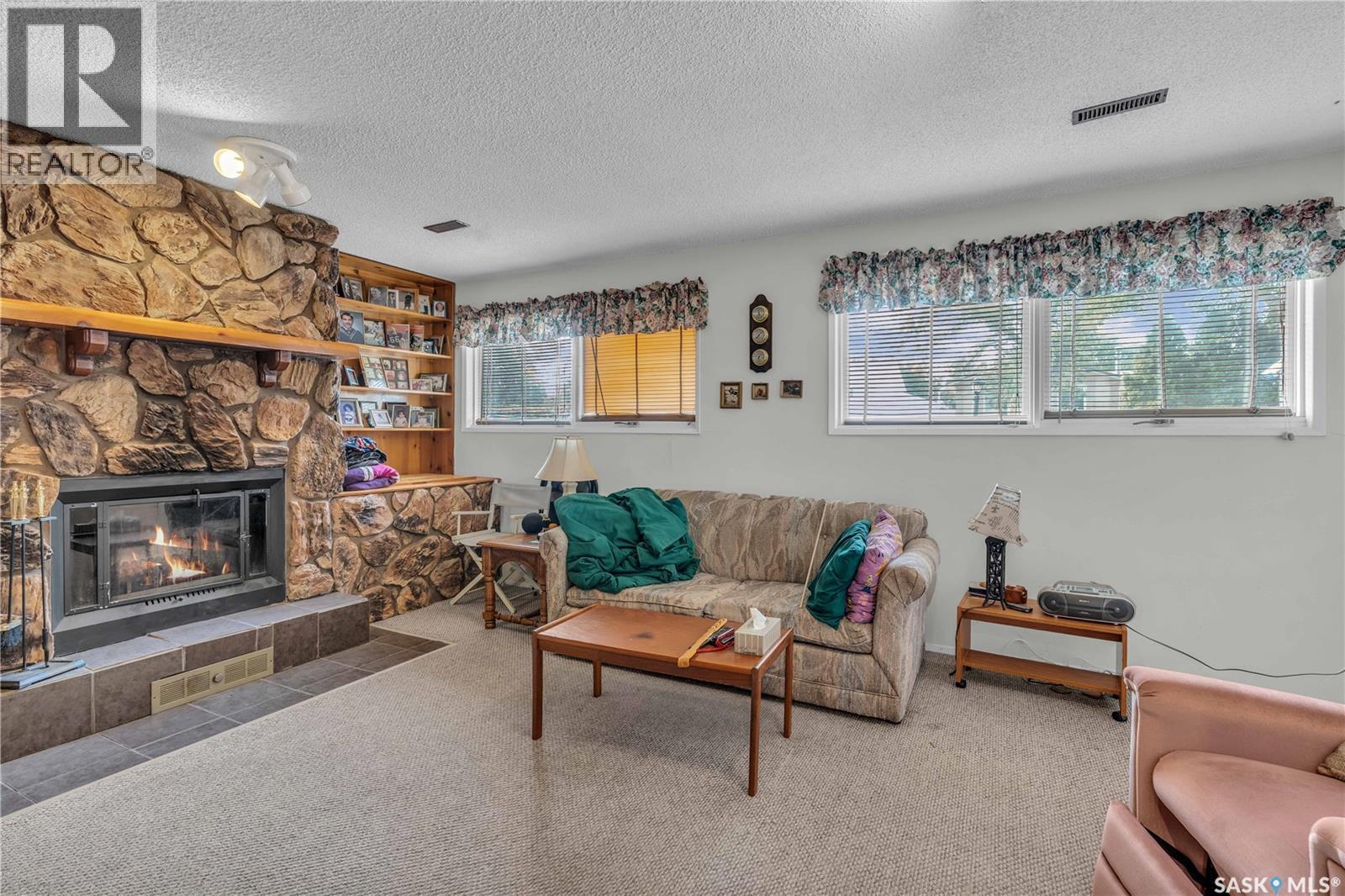 110 Salemka Crescent, Regina, SK - Indoor Photo Showing Living Room With Fireplace