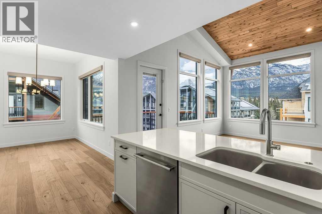 407, 1505 Spring Creek Gate, Canmore, AB - Indoor Photo Showing Kitchen With Double Sink