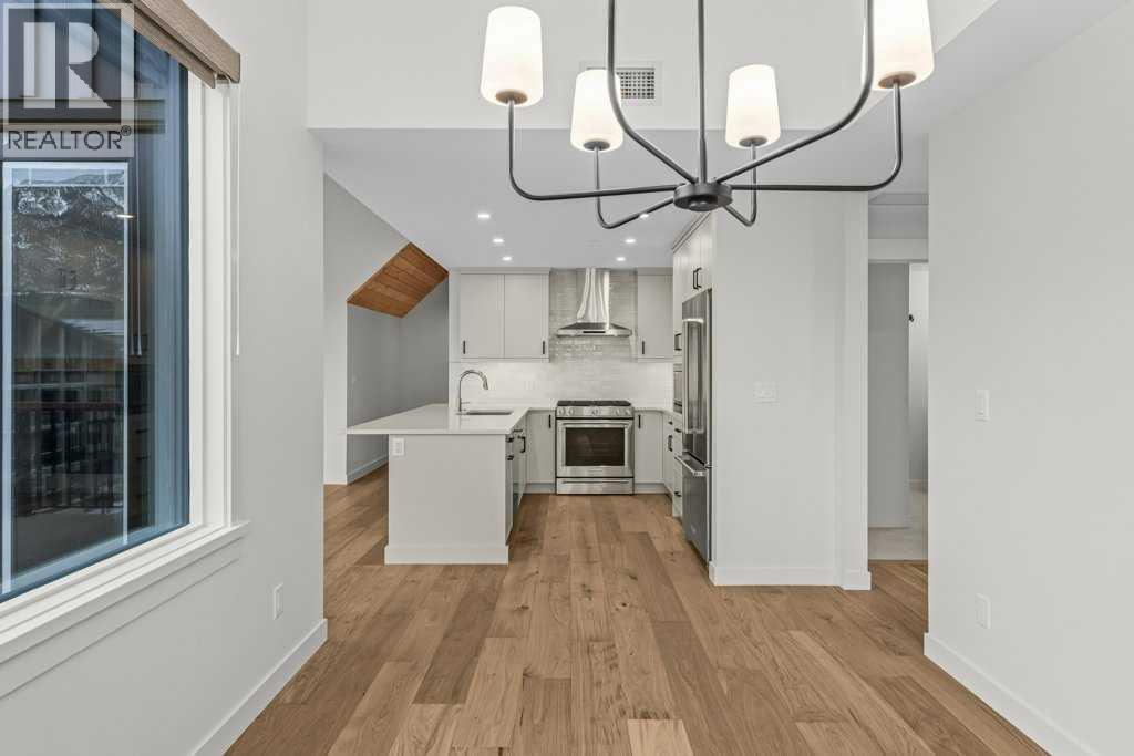 407, 1505 Spring Creek Gate, Canmore, AB - Indoor Photo Showing Kitchen