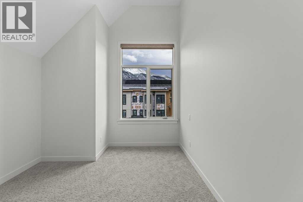 407, 1505 Spring Creek Gate, Canmore, AB - Indoor Photo Showing Other Room