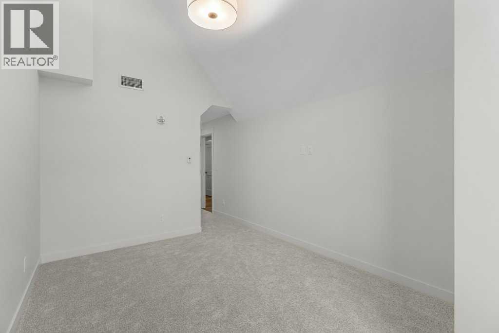 407, 1505 Spring Creek Gate, Canmore, AB - Indoor Photo Showing Other Room