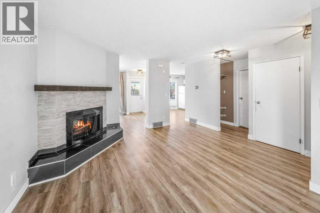 2140 146 Avenue Se, Calgary, AB - Indoor Photo Showing Living Room With Fireplace
