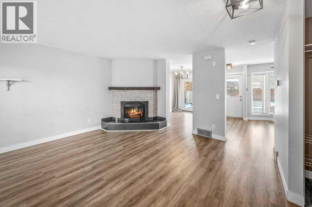 2140 146 Avenue Se, Calgary, AB - Indoor Photo Showing Living Room With Fireplace